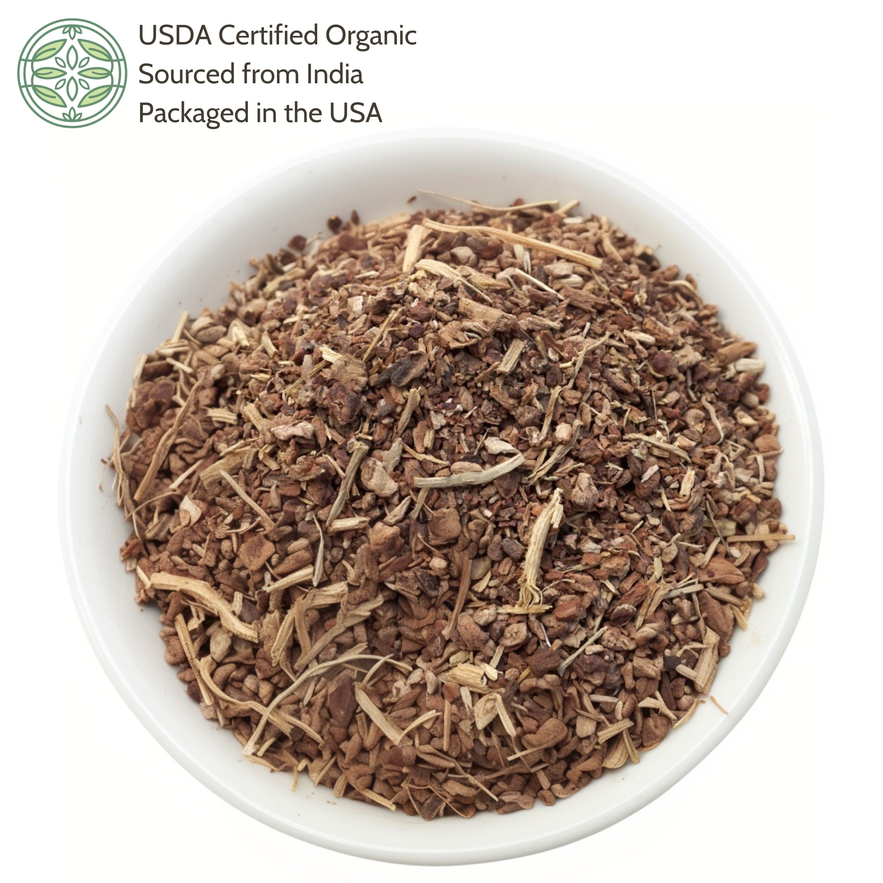 Dry herbs in a white bowl with USDA Certified Organic label on a white background