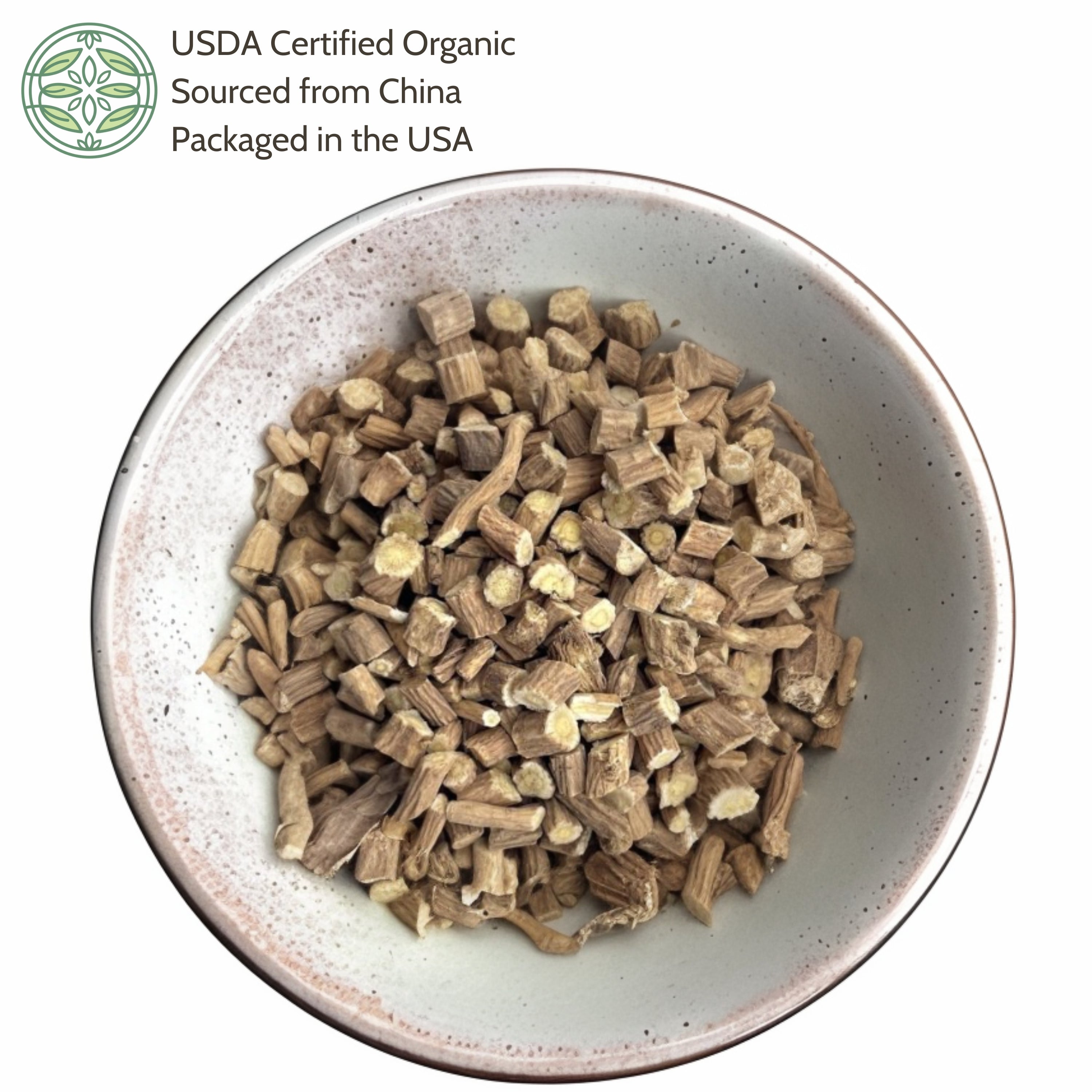 Dried herbs in a bowl with USDA Certified Organic label on a white background