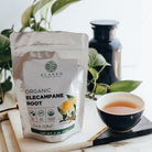 Elanen Organic Elecampane Root package with a cup of tea on a marble surface.
