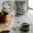 Stevia leaf packaging with a teapot and cups on a table