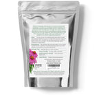 Silver packaging with a label featuring text and a pink flower illustration on a white background