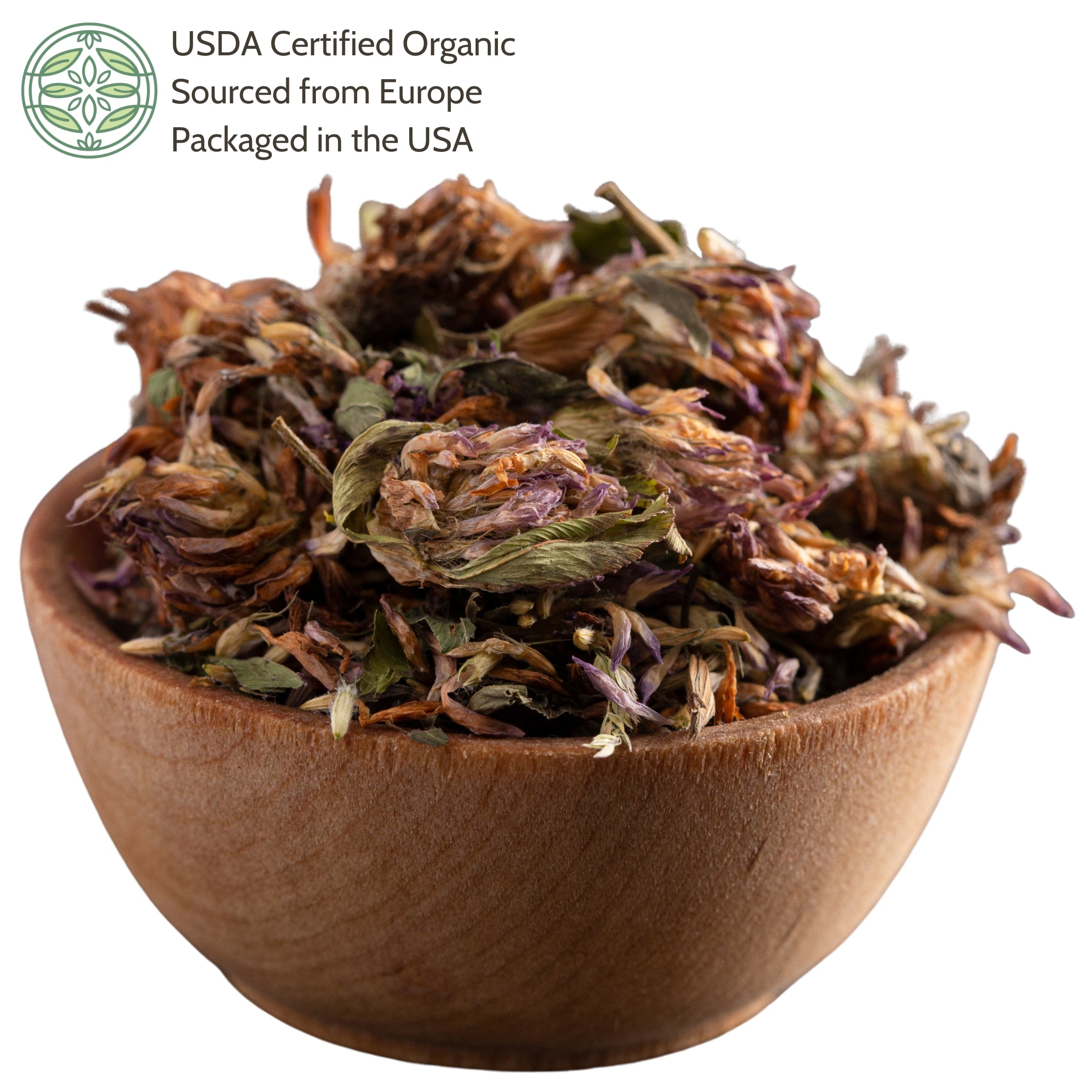 Wooden bowl filled with dried red clover.