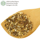 Wooden spoon filled with organic dandelion root