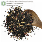 elderberry syrup mix on a wooden spoon