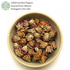 Bowl of dried red clover with USDA Certified Organic wording