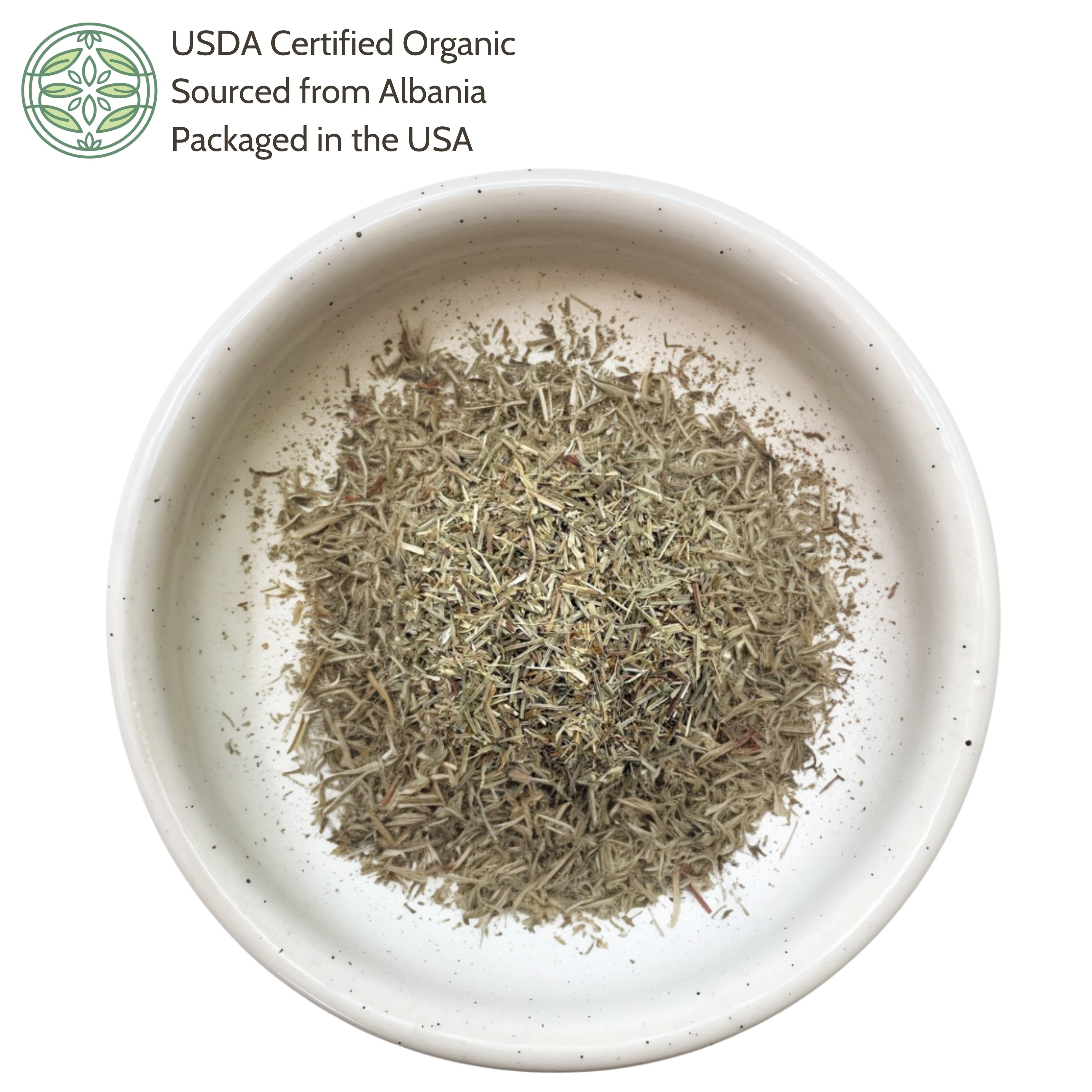 Dried herbs in a white bowl with USDA Certified Organic label on a white background