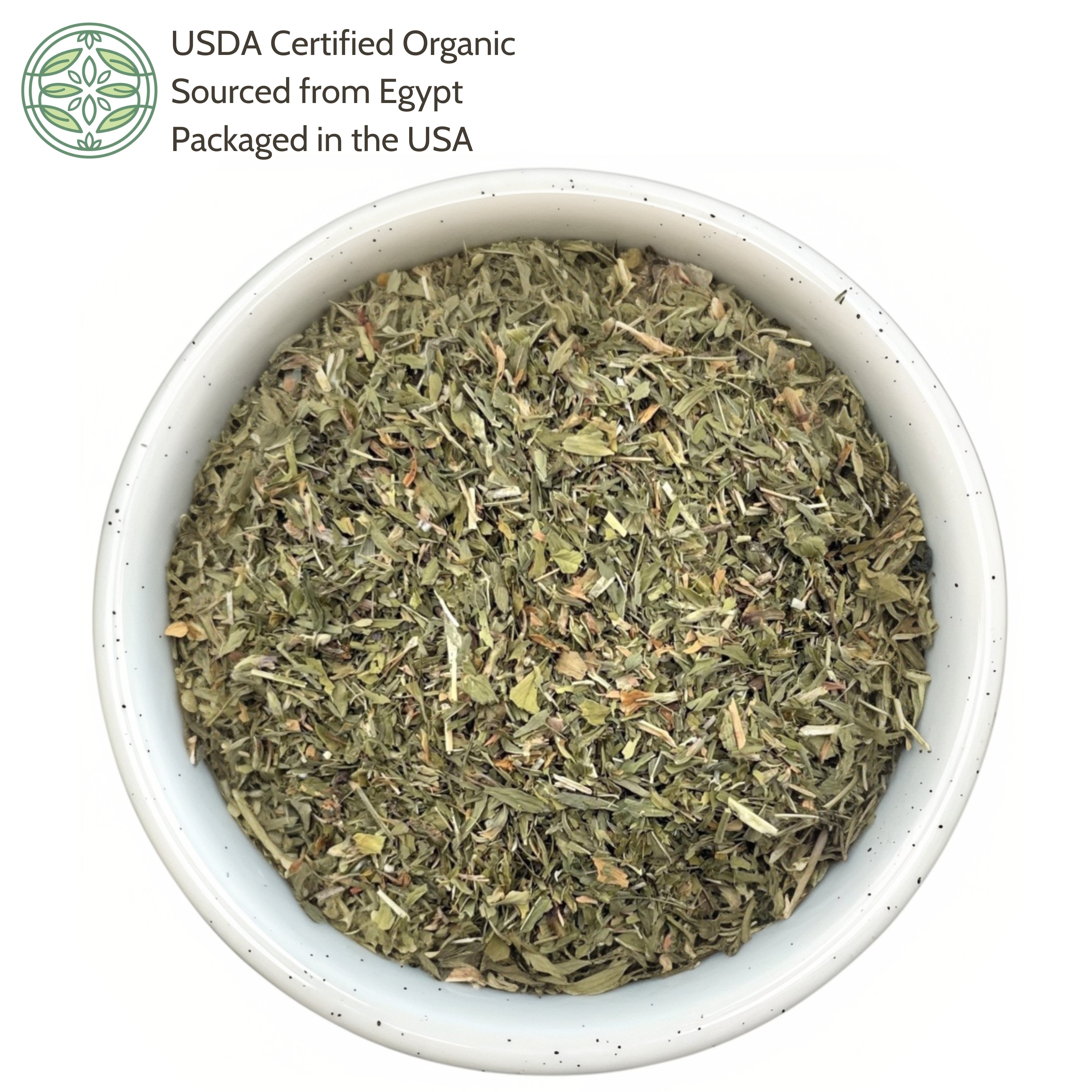 Bowl of dried herbs with USDA Certified Organic label on a white background