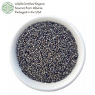 White bowl filled with organic chaste berry, sourced from Albania and packaged in the USA, on a white background.