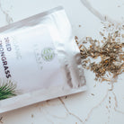 Bag of organic dried lemon grass on a marble surface